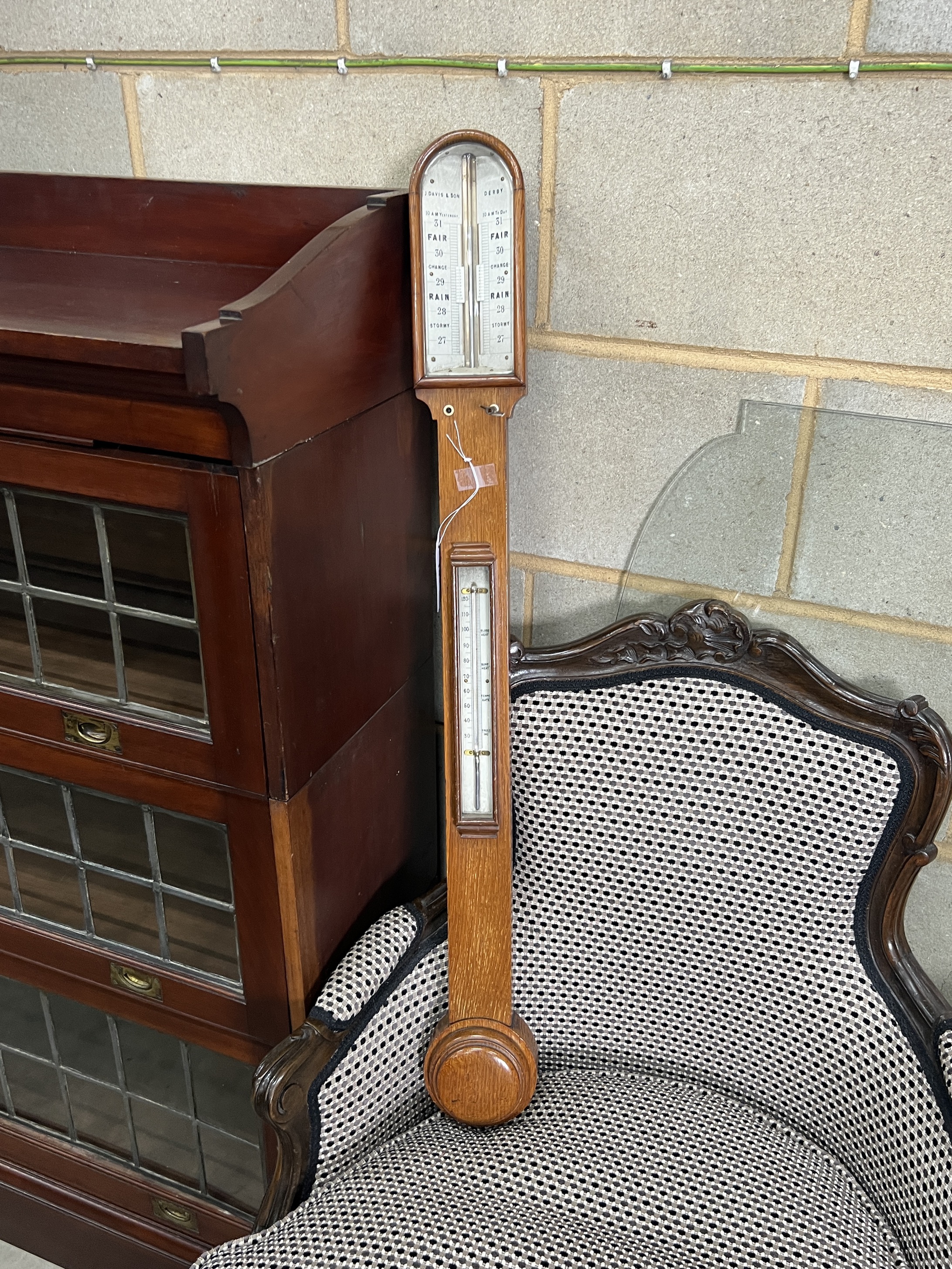 A Victorian oak stick barometer and thermometer, marked Davis & Son, Derby, height 93cm